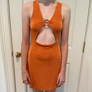 Orange go-go girl dress. Cut out in middle